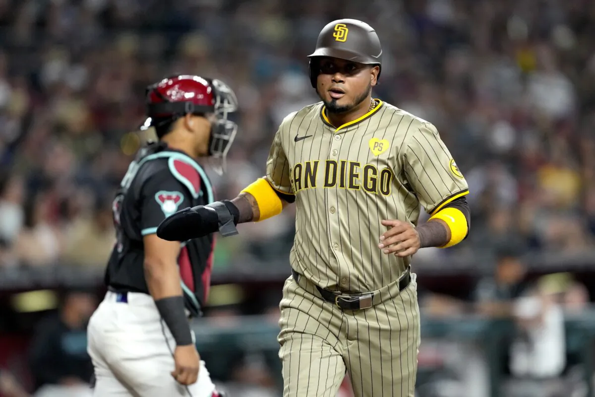 San Diego Padres' Luis Arraez scores on a base hit by Manny Machado during the first inning of a baseball game against the Arizona Diamondbacks in Phoenix on May 4, 2024. (Matt York/AP Photo)