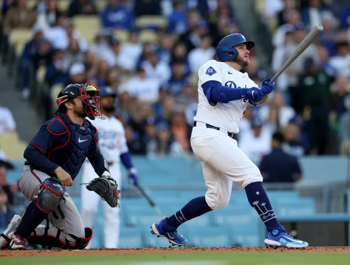 Max Muncy (13) of the Los Angeles Dodgers watches his two run home run with Travis d'Arnaud (16) of the Atlanta Braves during the second inning in Los Angeles on May 4, 2024. (Harry How/Getty Images)