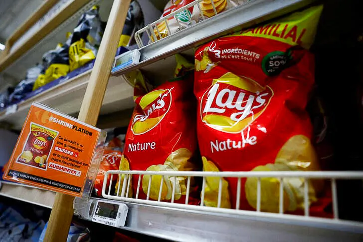 A sign reading "Shrinkflation, This product has seen its weight decrease and the price charged by our supplier increase" at a Carrefour supermarket in Montesson near Paris, France, on Sept. 13, 2023. (Sarah Meyssonnier/Reuters)