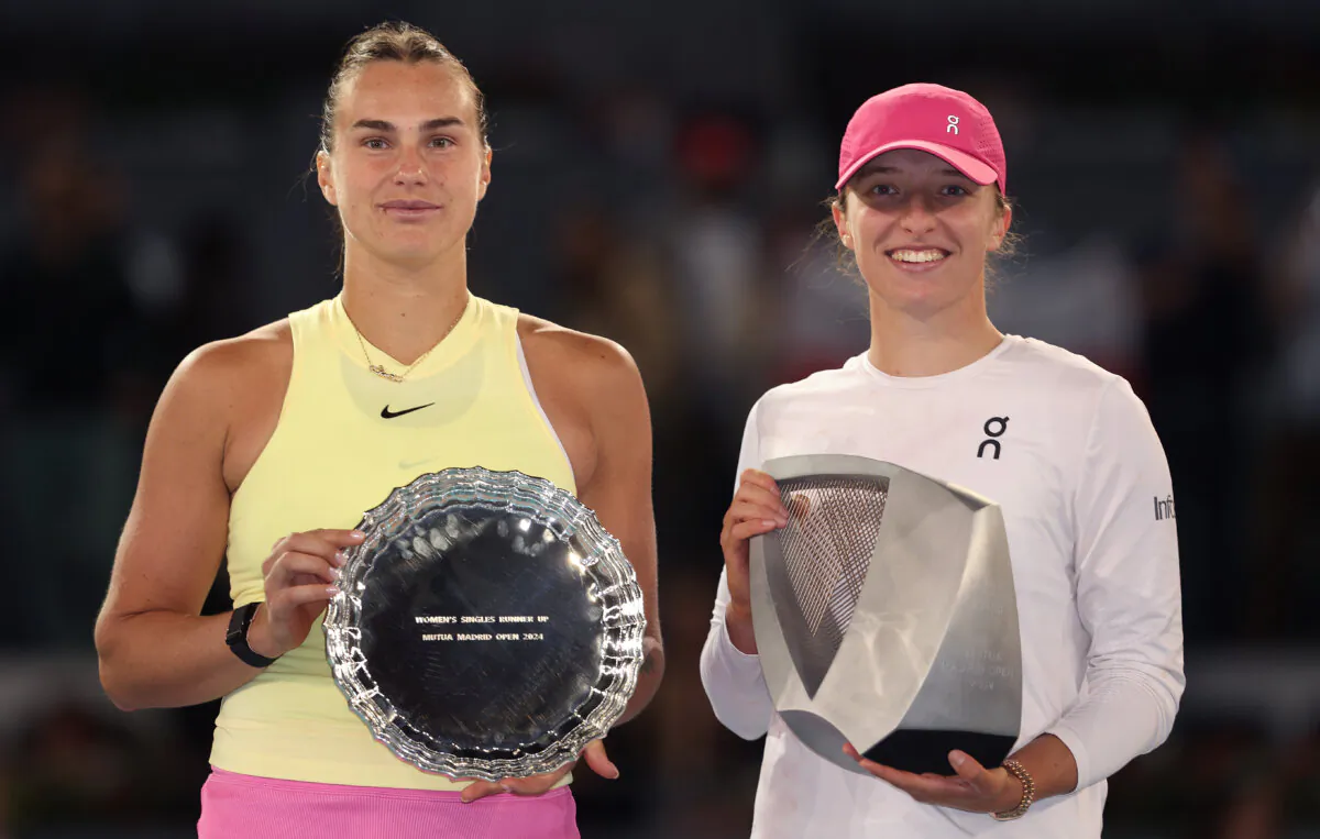 Iga Swiatek of Poland poses for a photo with the winners trophy after victory against Aryna Sabalenka of Belarus following their Women's Singles Final match on Day Twelve of Mutua Madrid Open in Madrid on May 4, 2024. (Julian Finney/Getty Images)