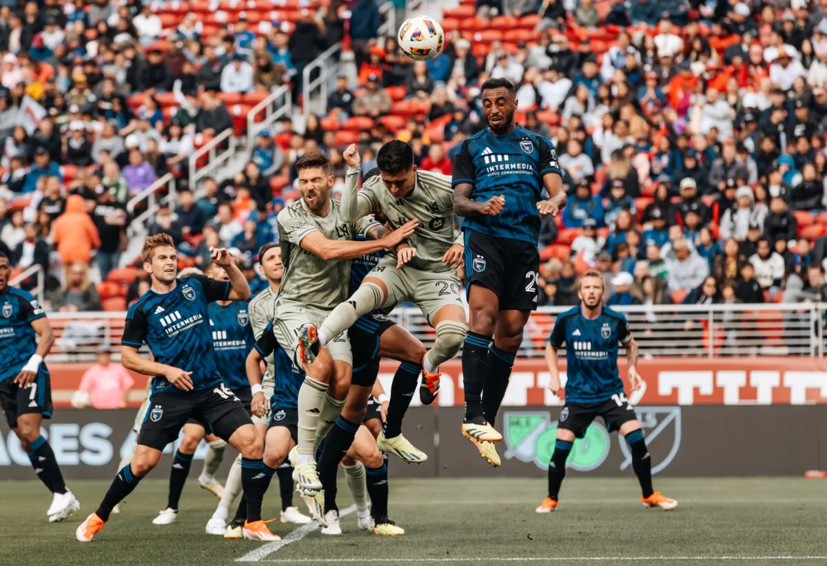LAFC defender Ryan Hollingshead (24-L) and midfielder Eduard Atuesta (20) challenge San Jose Earthquakes defender Carlos Akapo (29) for a cross during a match in San Jose, Calif., on May 4, 2024. (Courtesy of LAFC via The Epoch Times)