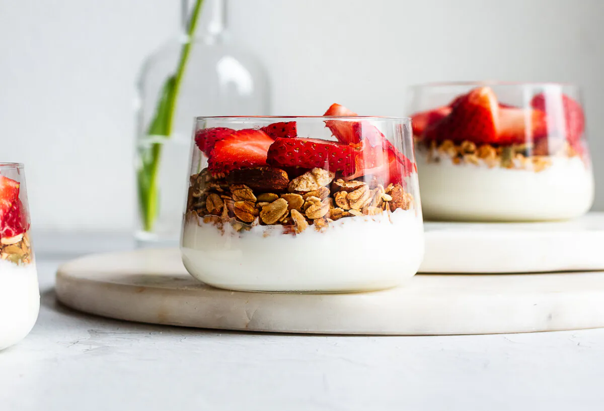 Kids can assemble simple but delicious breakfast parfaits by spooning yogurt, fruit, and granola into glasses. (Jennifer McGruther)