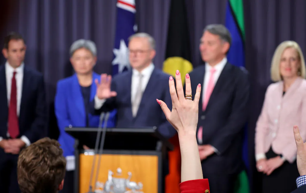 A journalists raises her hand as Prime Minister Anthony Albanese (C) speaks standing next to (L-R) Jim Chalmers, Penny Wong, Richard Marles and Katy Gallagher during a press conference at Parliament House in Canberra, Australia on May 23, 2022. (David Gray/Getty Images)
