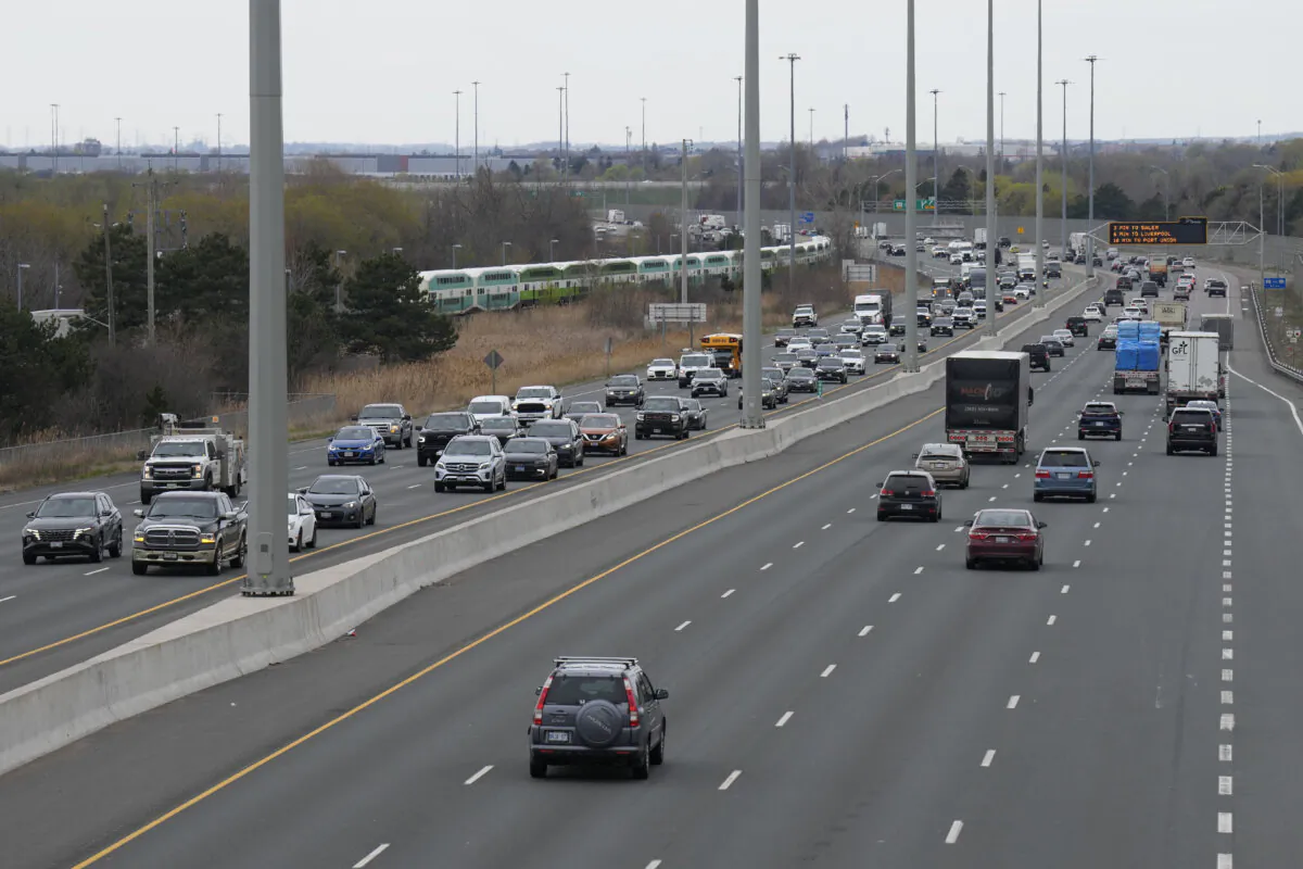 Traffic moves along a stretch of Highway 401 in Whitby, Ont., on April 30, 2024. (The Canadian Press/Chris Young) 