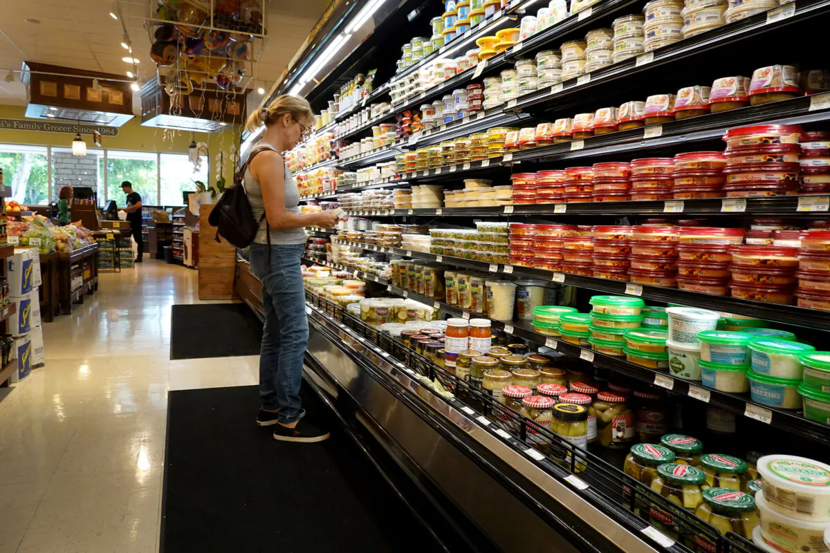 A shopper makes her way through a grocery store in Miami, Fla., on July 12, 2023. (Joe Raedle/Getty Images)