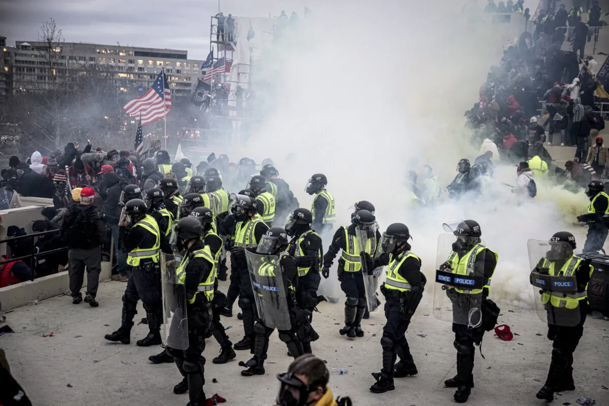 Capitol Police officers use pepper spray and tear gas to clear protesters from the U.S. Capitol in Washington on Jan. 6, 2021. (Brent Stirton/Getty Images)