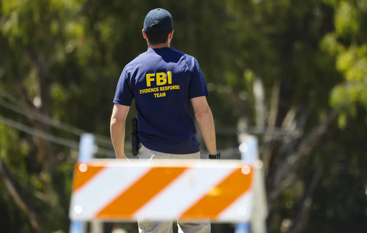 An FBI agent walks toward a crime scene in Gilroy, Calif., on July 29, 2019. (Mario Tama/Getty Images)