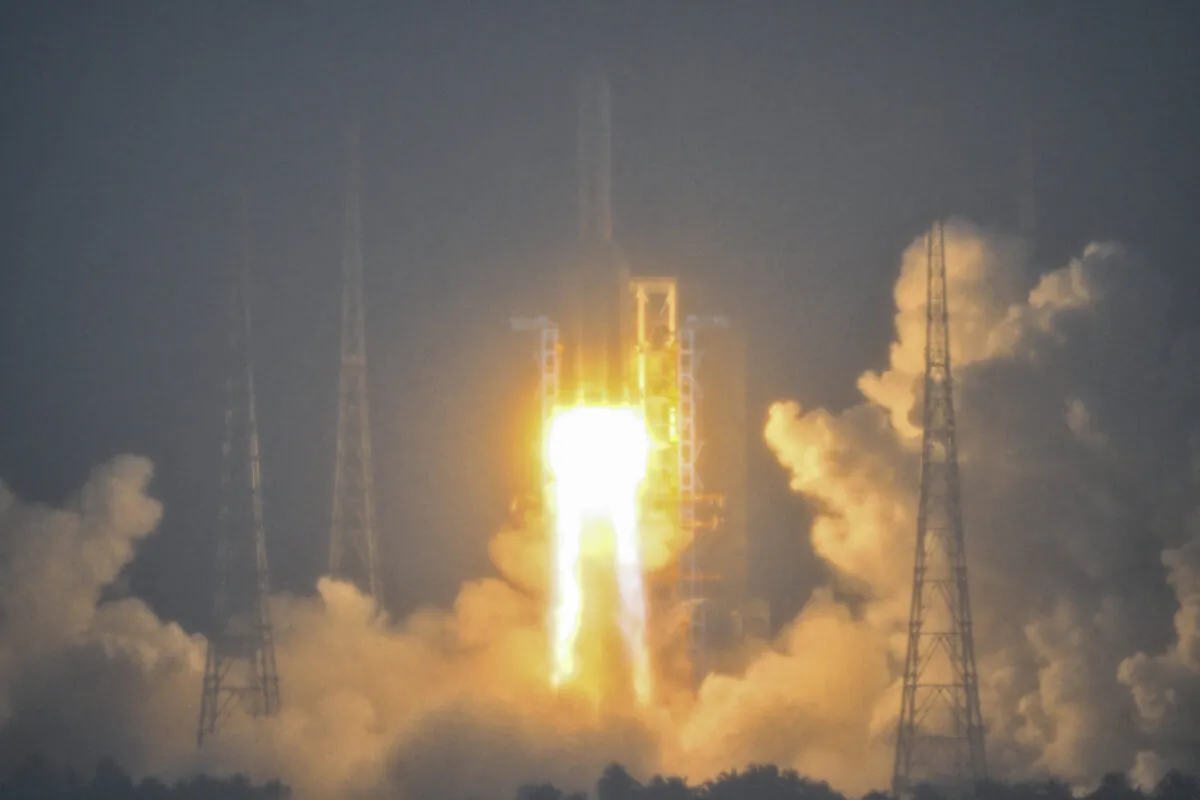 China's Long March 5 rocket, carrying the Chang'e-6 mission lunar probe, lifts off as it rains at the Wenchang Space Launch Centre in southern China's Hainan Province on May 3, 2024. (Hector Retamal/AFP via Getty Images)