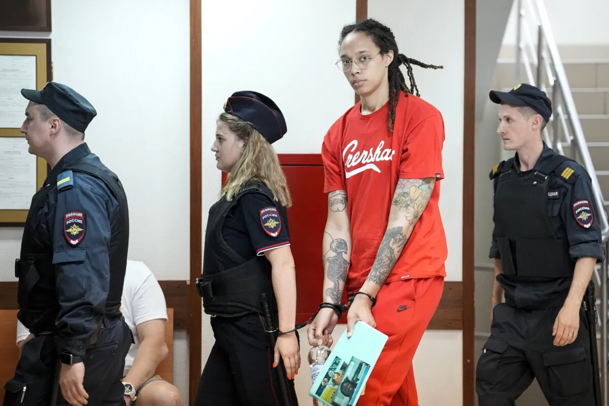 WNBA star Brittney Griner is escorted to a courtroom for a hearing in Khimik, Russia, outside Moscow, on July 7, 2022. (Alexander Zemlianichenko/AP Photo)