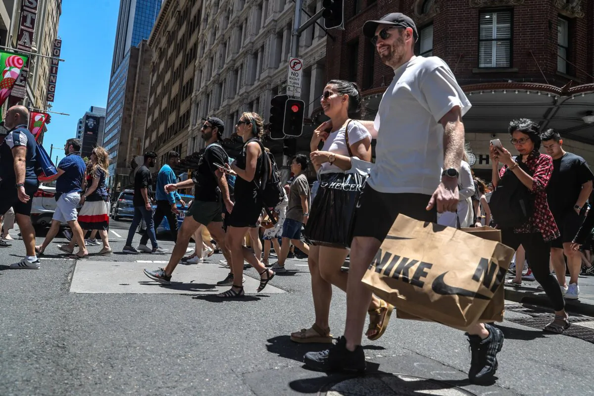 Shoppers cross the road at Pitt Street in Sydney, Australia, on Dec. 26, 2022. (Roni Bintang/Getty Images)