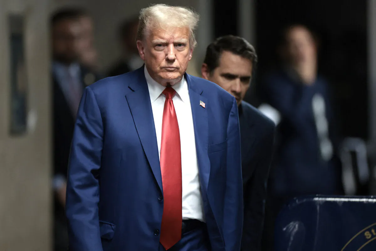 Former President Donald Trump walks toward the press to speak before departing for the day at his trial for allegedly covering up hush money payments linked to extramarital affairs, at Manhattan Criminal Court in New York City, on May 6, 2024. (Win McNamee/Pool/AFP via Getty Images)