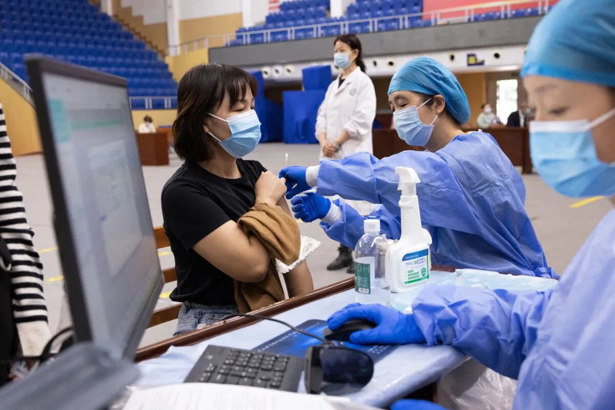 A resident receives a COVID-19 vaccine in Wuhan, central Hubei Province, China, on Oct. 14, 2021. (STR/AFP via Getty Images)