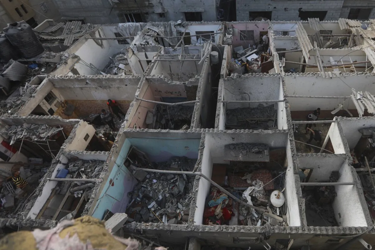 Destroyed buildings after an Israeli strike on residential building in Rafah, Gaza Strip, on May 7, 2024. (Ismael Abu Dayyah/AP Photo)