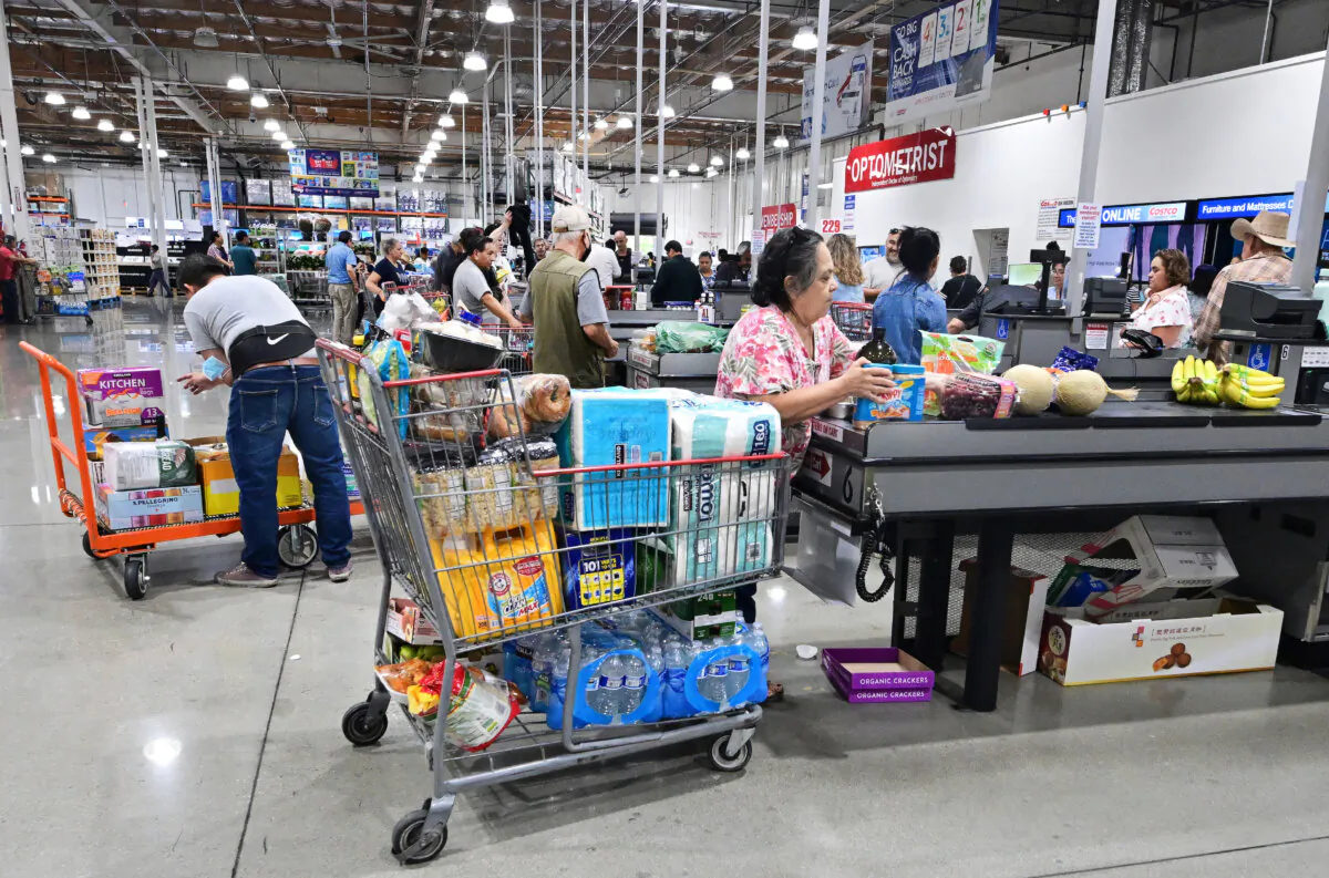 Shoppers place their items on the checkout counter at a wholesale distributor in Alhambra, Calif., on Sept. 12, 2023. (Frederic J. Brown/AFP via Getty Images)