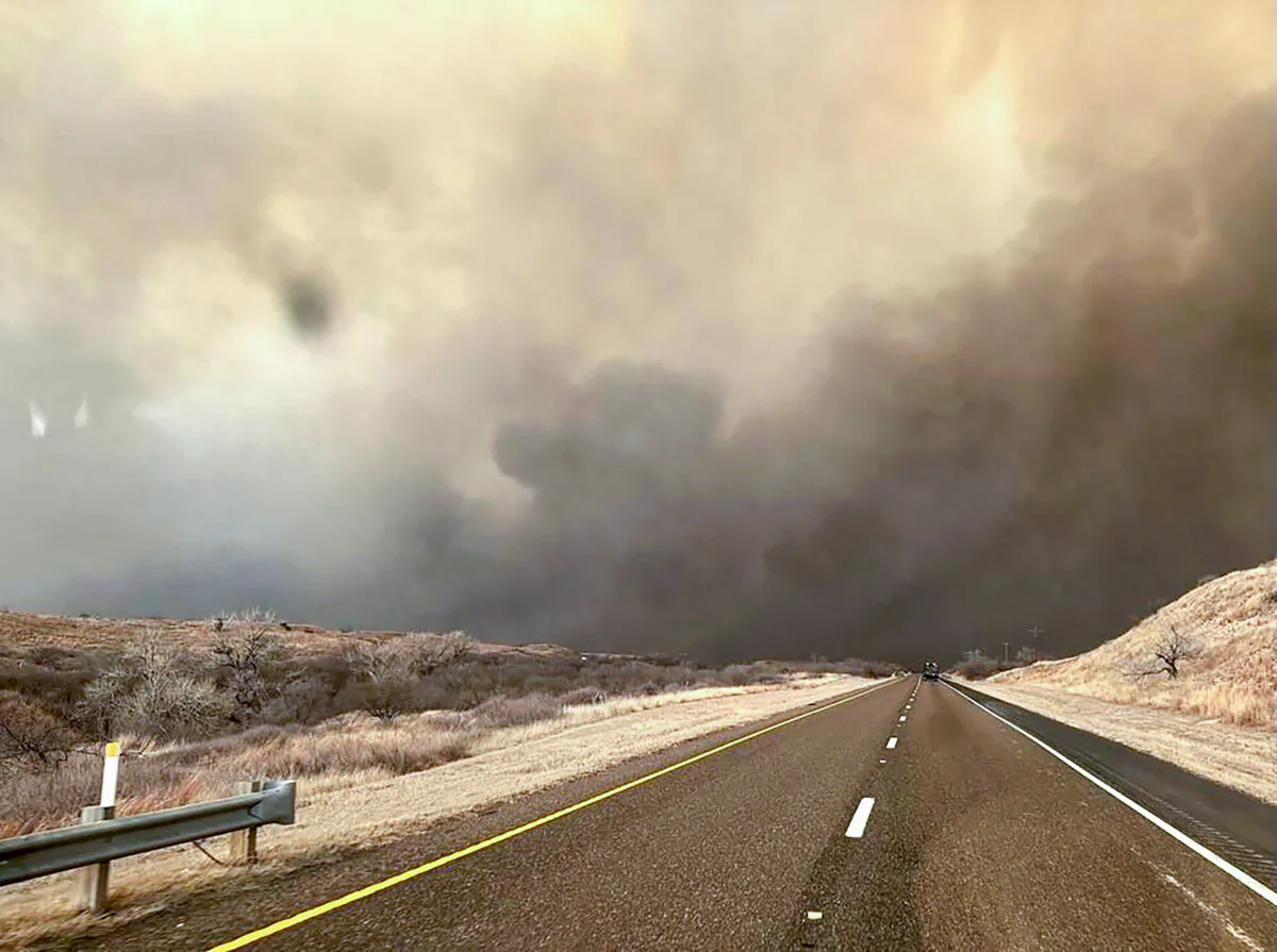 Smoke billows over a road during the Smokehouse Creek Fire in the Texas panhandle on Feb. 27, 2024. (Texas A&M Forest Service via Getty Images)