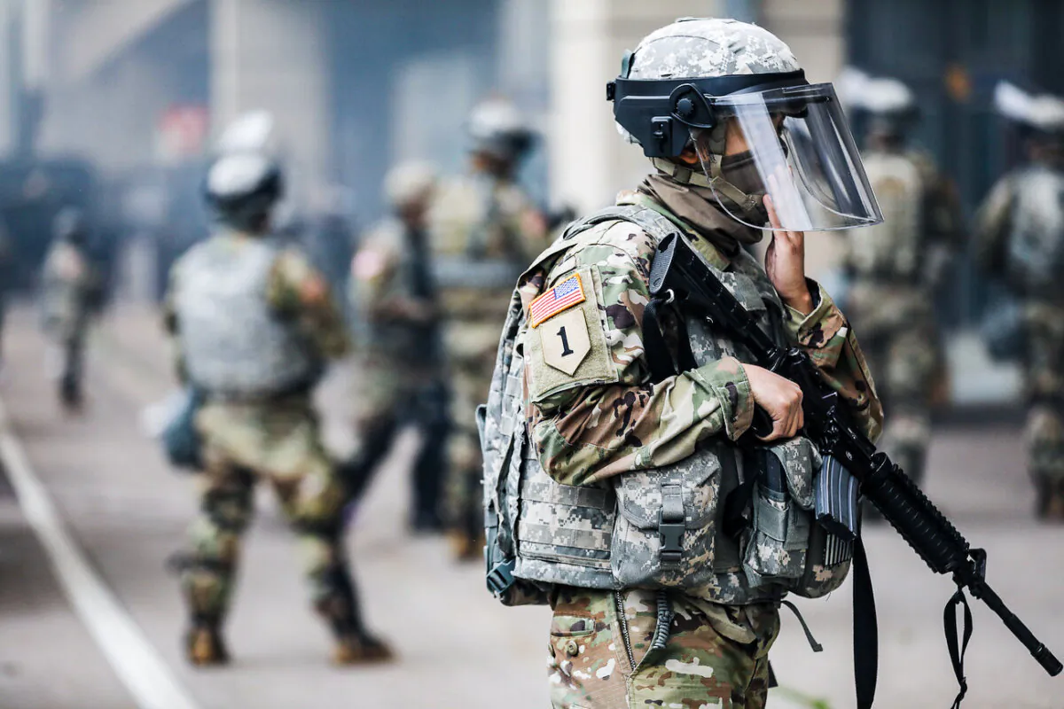 The National Guard near the Lake Street/Midtown metro station in Minneapolis on May 29, 2020. (Charlotte Cuthbertson/The Epoch Times)