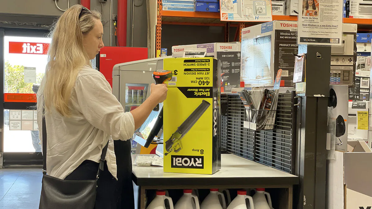 A customer makes a purchase in a self-checkout lane at a Home Depot store in San Rafael, Calif., on July 25, 2023. (Photo by Justin Sullivan/Getty Images)