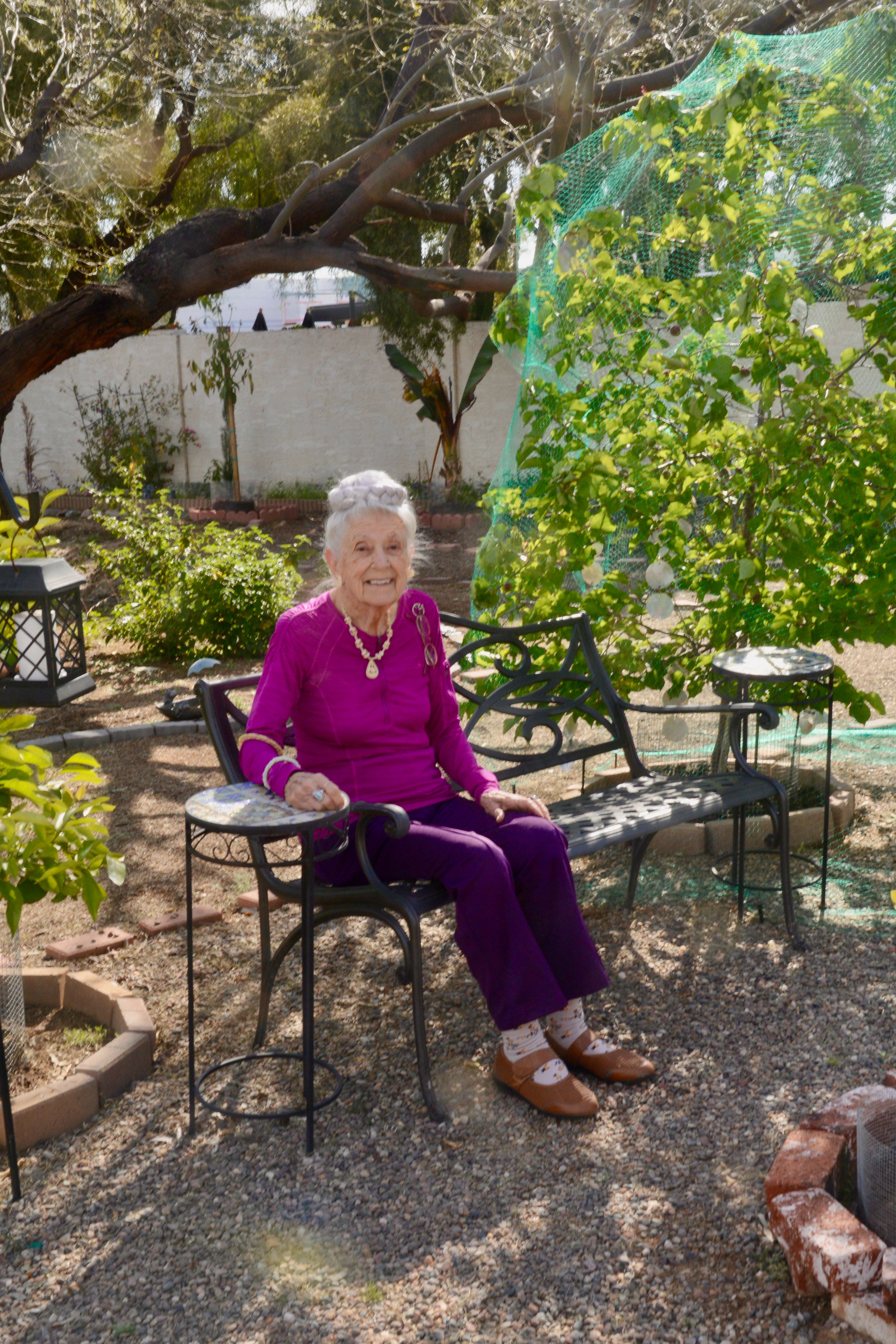 Dr. Gladys enjoying the garden (Courtesy of Lynne Erickson via Gladys McGarey)