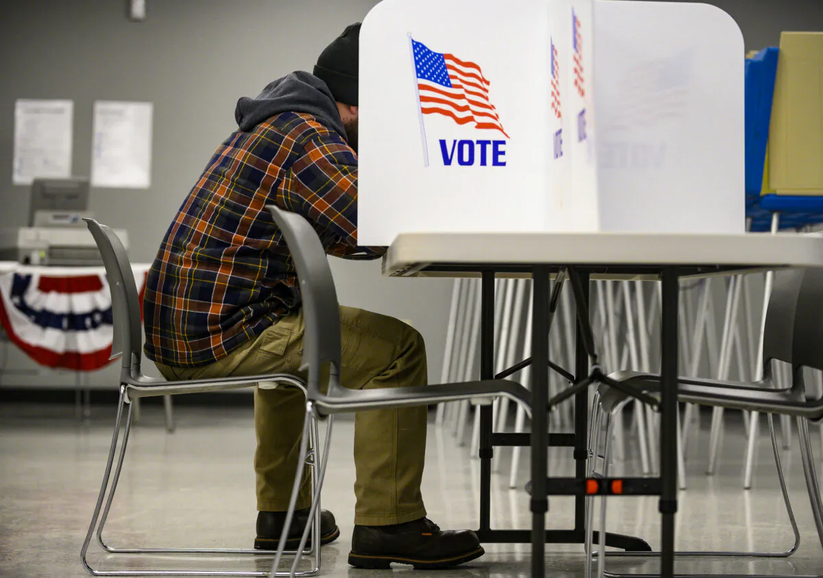 A voter fills out a registration form at the Minneapolis Early Vote Center on Jan. 17, 2020 in Minneapolis, Minnesota. (Stephen Maturen/Getty Images)
