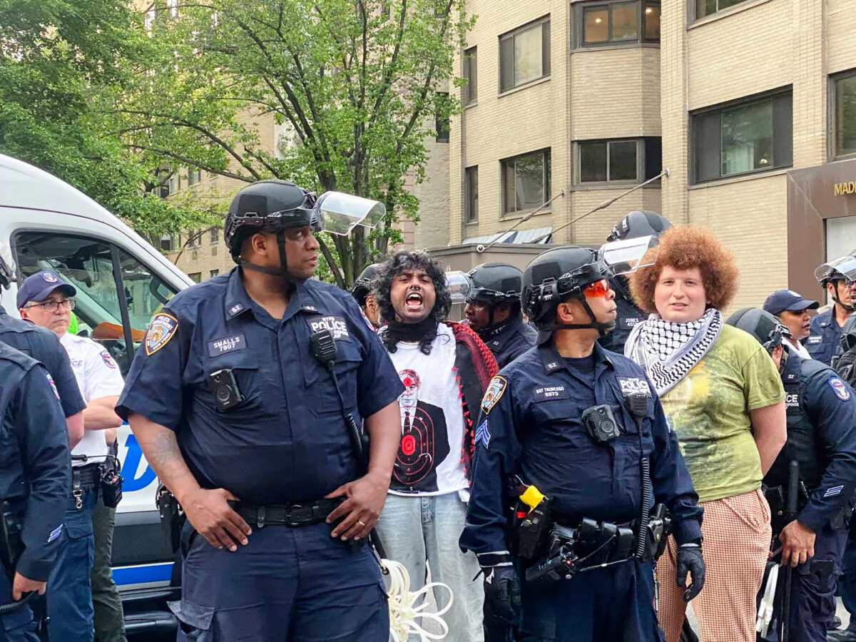 Police arrest protesters near the Met Gala in New York on May 6, 2024. (Enrico Trigoso/The Epoch Times)