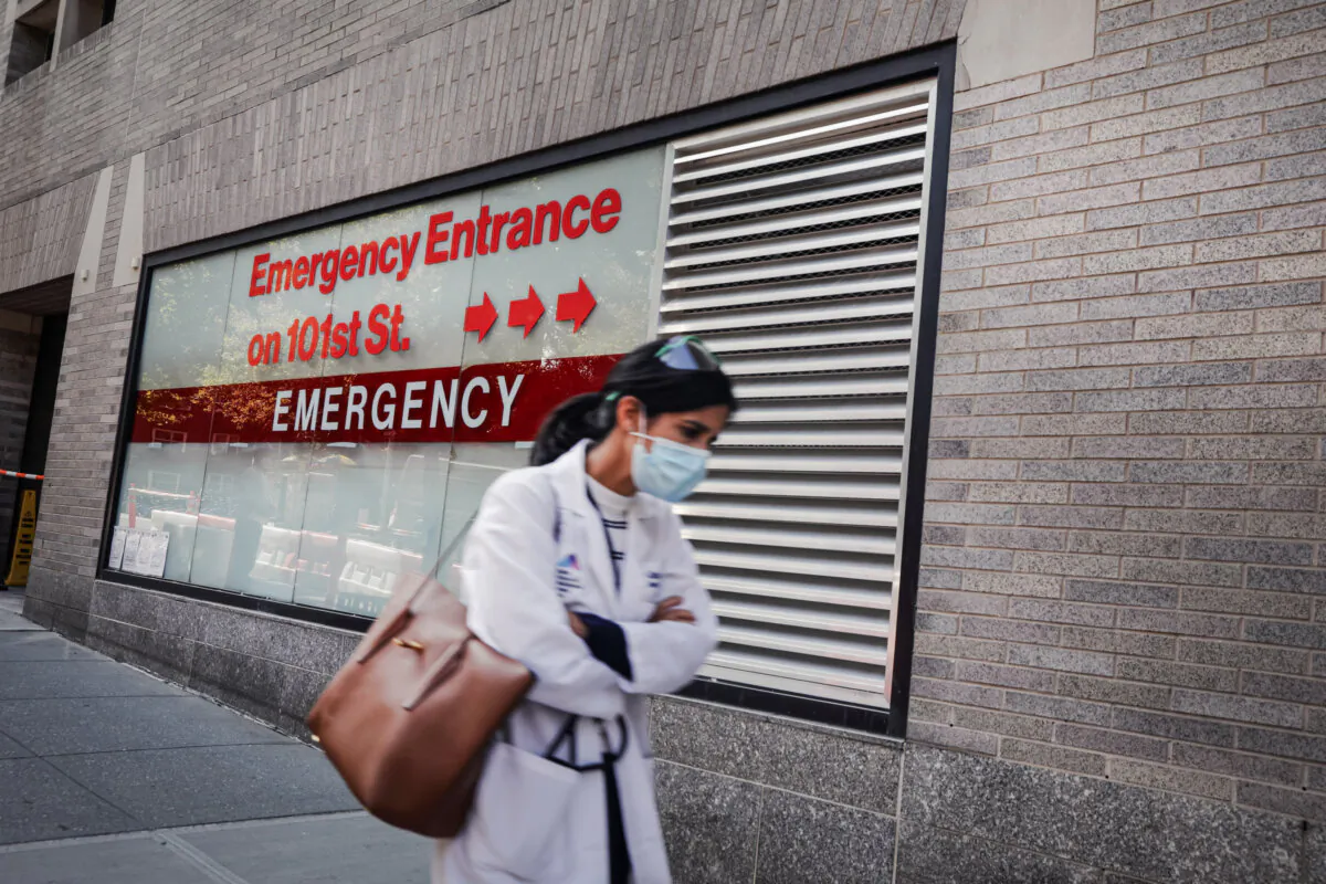 A person walks past an “Emergency Entrance” sign at Mount Sinai Hospital in New York City on Sept. 22, 2020. (Spencer Platt/Getty Images)