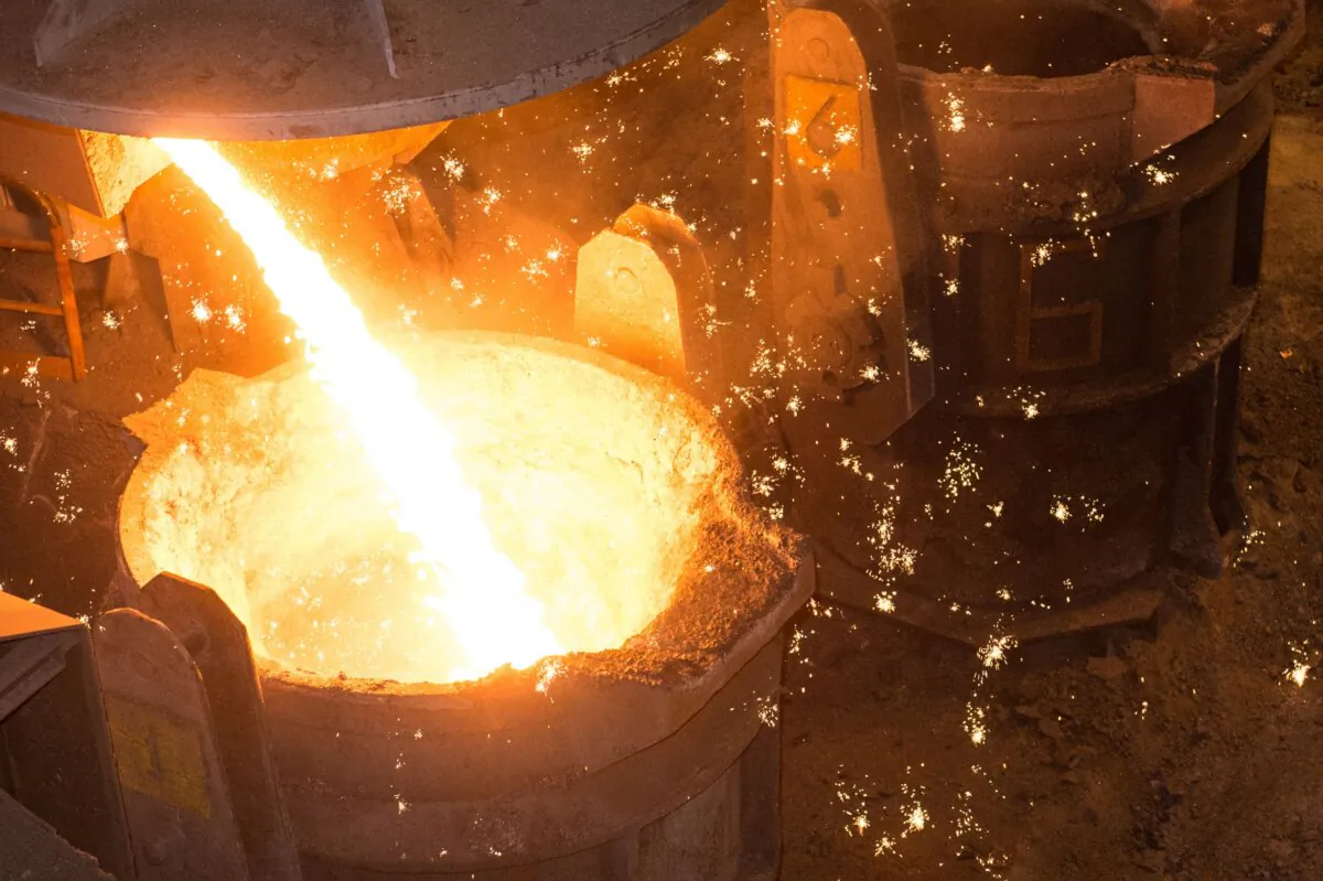 Cast iron is poured into a crucible during the smelting and casting process at the Saint-Gobain PAM factory in Pont-à-Mousson, France, on April 12, 2016. (Sebastien Bozon/AFP via Getty Images)