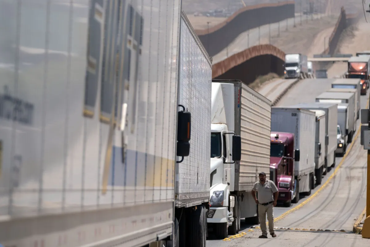 Cargo truck drivers line up to cross to the United States at Otay commercial crossing port in Tijuana, Mexico, on June 6, 2019. (Guillermo Arias/AFP via Getty Images)