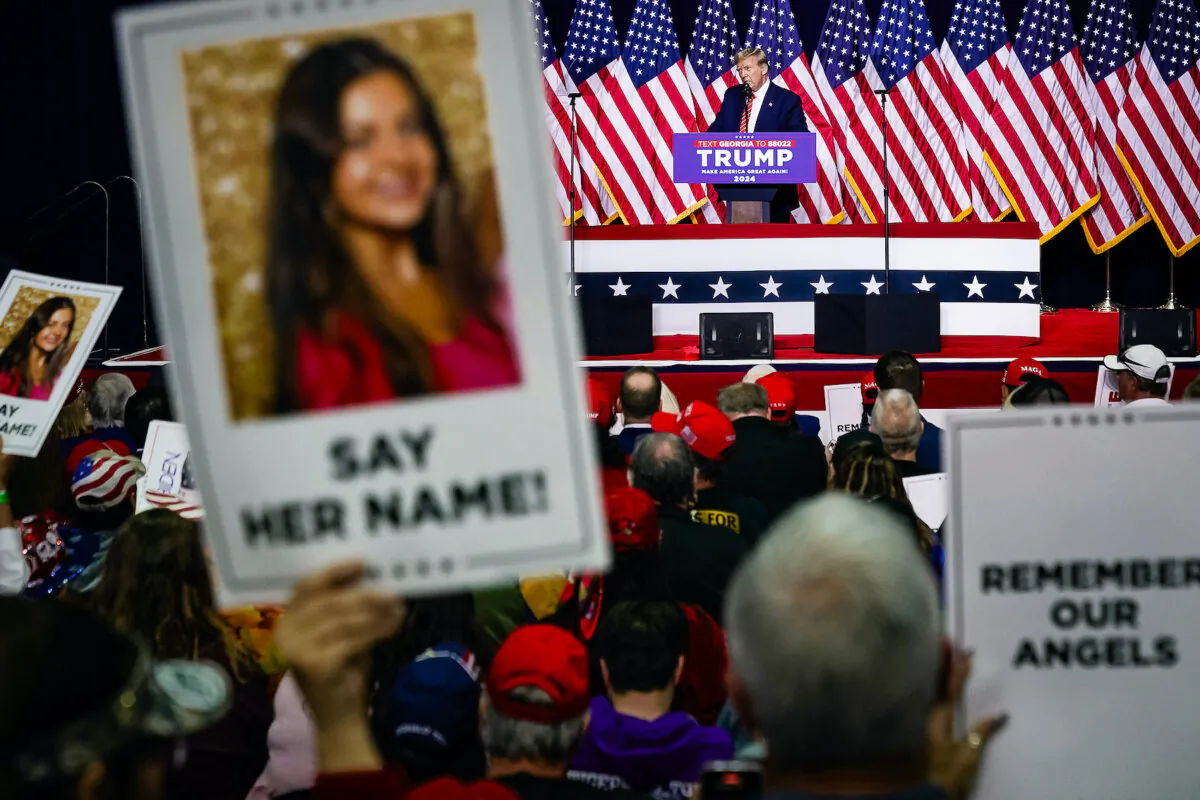Former President and 2024 presidential hopeful Donald Trump speaks as supporters hold images of Laken Riley during a campaign event in Rome, Ga., on March 9, 2024. (Elijah Nouvelage/AFP via Getty Images)