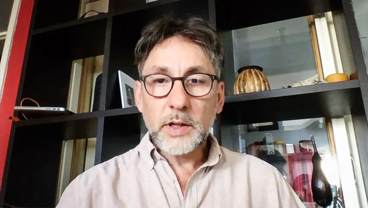 Falun Gong practitioner Dejan Markovic in an interview with NTD from his home in Belgrade, Serbia, in July 2021. (Screenshot/NTD)