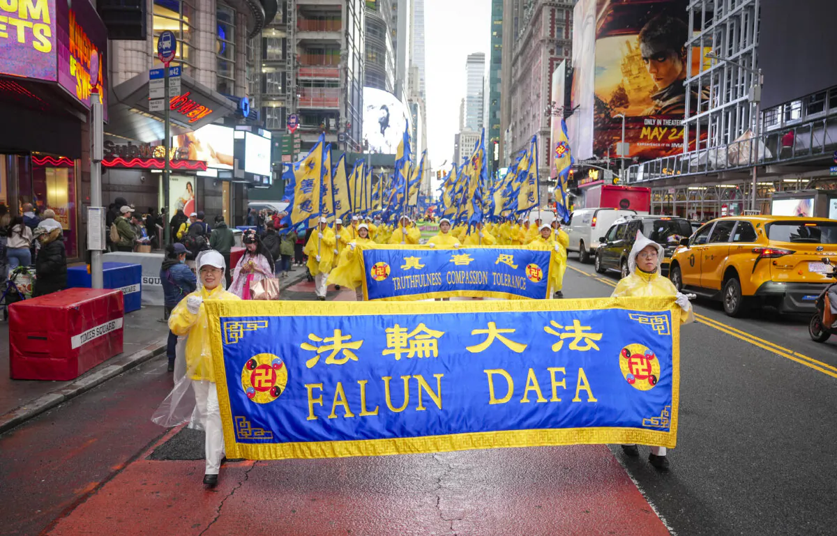 Falun Gong practitioners take part in a parade to celebrate World Falun Dafa Day while calling for an end of the persecution in China, in New York City, on May 10, 2024. (Samira Bouaou/The Epoch Times)