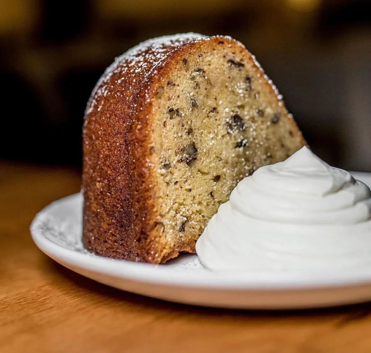 A pecan-studded slice of Nonna's Rum Cake at 1310 Kitchen and Bar, in Washington, D.C. (Courtesy of Jenn Crovato)