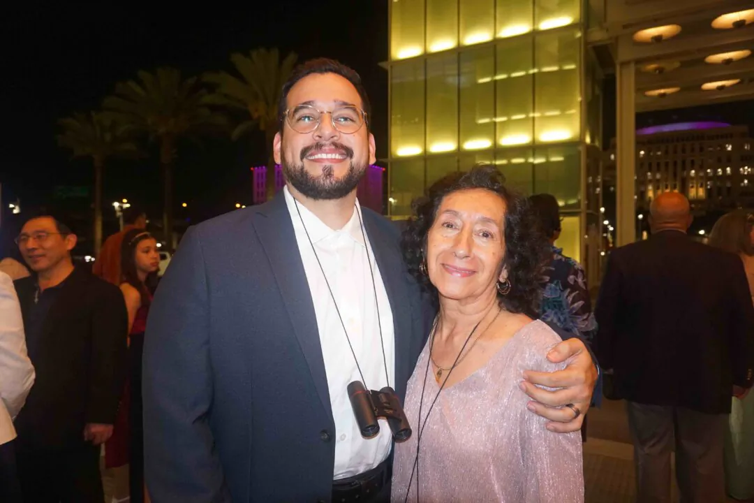 Mo Borbon and his mother Martha enjoyed Shen Yun's evening performance at the Dr. Phillips Center for the Performing Arts on May 10, 2024. (Yeawen Hung/The Epoch Times)