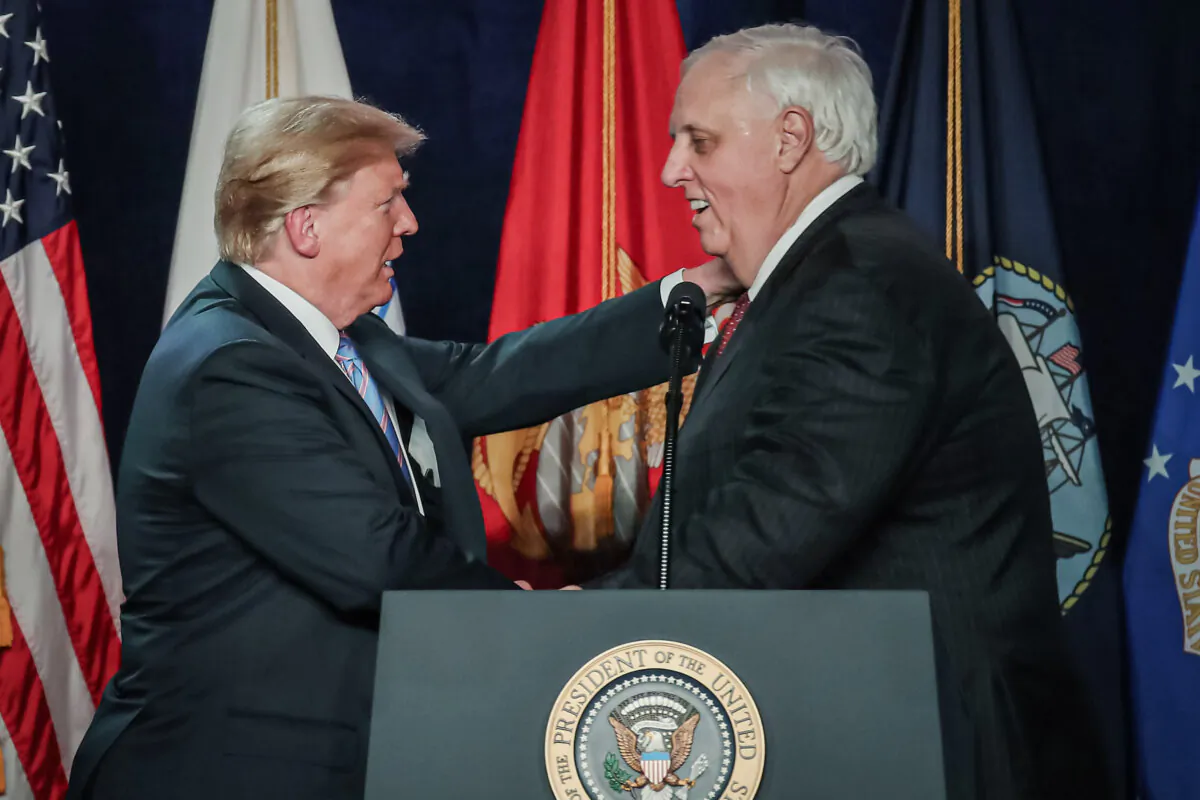 President Donald Trump greets West Virginia Gov. Jim Justice during a dinner at the Greenbrier Resort in White Sulphur Springs, W.Va., on June 3, 2018. (Mark Wilson/Getty Images)