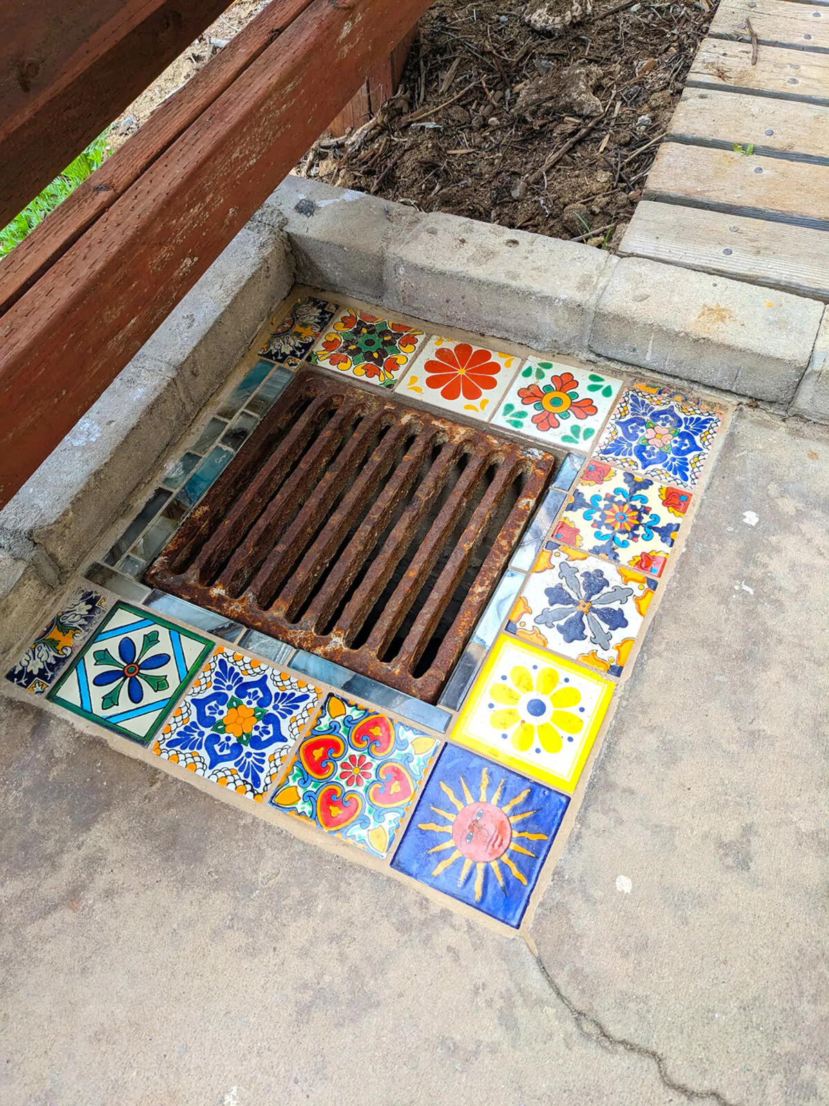Ceramic tile transforms a dull storm drain into a festive feature at this condo property in California. (Tim Carter/Tribune Content Agency/TNS)