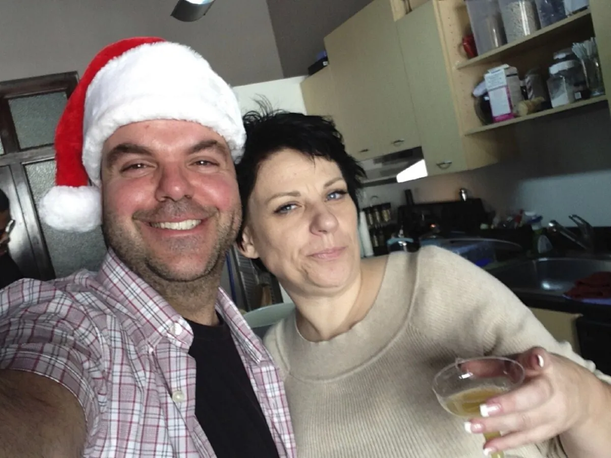 Johnathan Walton and Marianne Smyth pose during her tree trimming Christmas party in Los Angeles in December 2013. (Johnathan Walton via AP)
