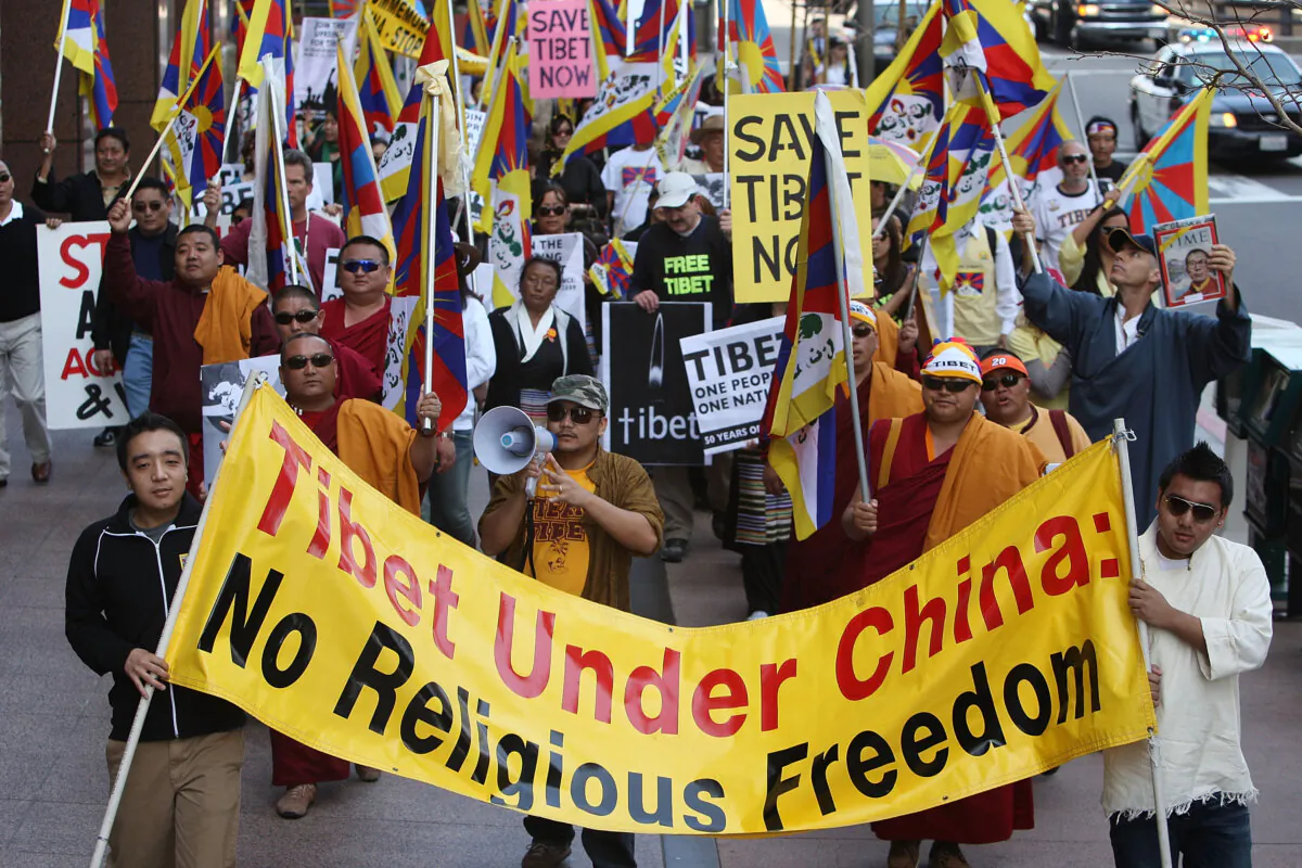 Members and supporters of the Tibetan Association of Southern California and Los Angeles Friends of Tibet march on the 50th anniversary of the first Tibetan uprising against Chinese rule and the escape of the 14th Dalai Lama into exile, in Los Angeles, Calif., on March 10, 2009. (David McNew/Getty Images)