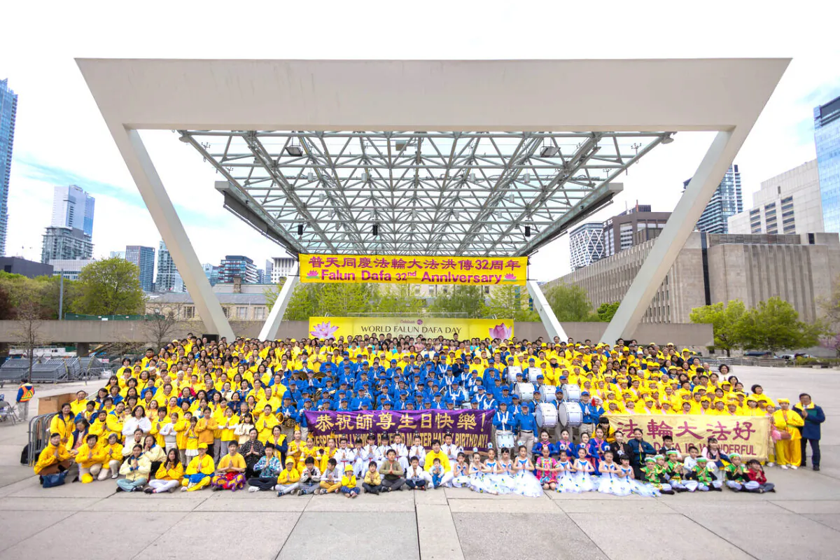 Falun Gong adherents  celebrate the 32nd World Falun Dafa Day outside of the Toronto City Hall on May 11, 2024. (Alex Gurevich/The Epoch Times)