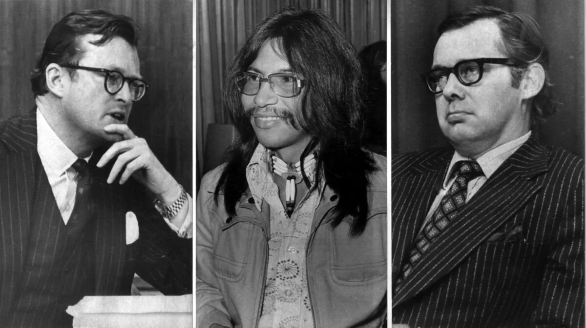 Justice Thomas Berger (R) listens to testimony from Michael Goldie, counsel for Canadian Arctic Gas Pipelines Ltd. (L), as James Wah-Shee, president of the Dene Nation, looks on, during the Mackenzie Valley Pipeline Inquiry in Ottawa on May 7, 1974. (CP Picture Archive/Fred Chartrand)