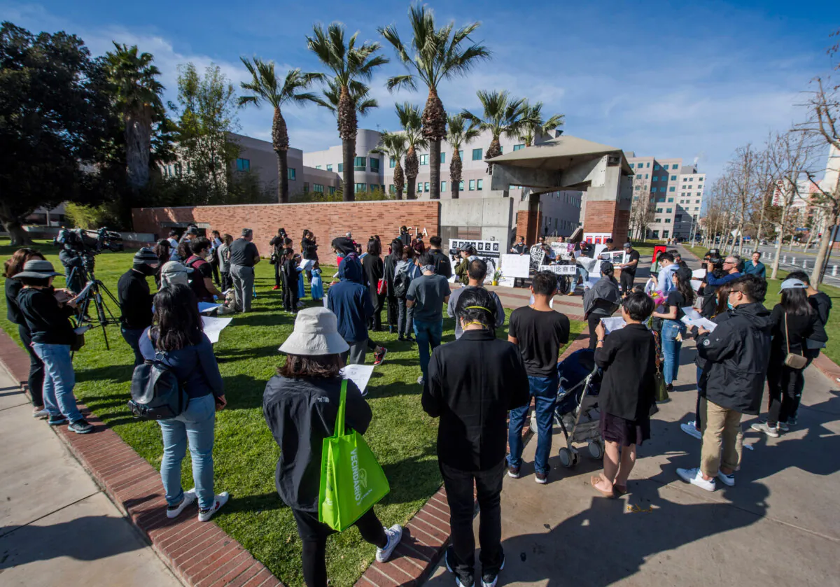 Chinese students and their supporters hold a memorial for Dr. Li Wenliang outside the UCLA campus in Westwood, Calif., on Feb. 15, 2020. (Mark Ralston/AFP via Getty Images)