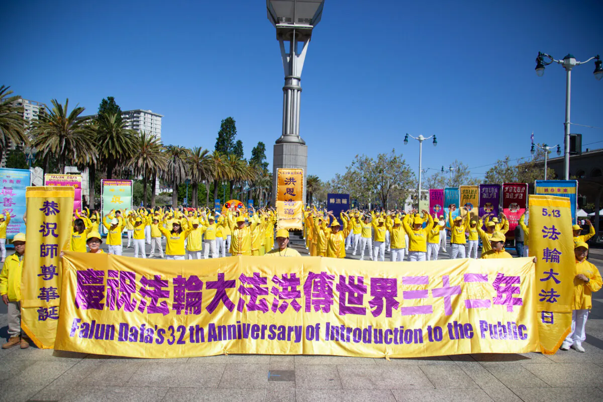Practitioners do the Falun Dafa exercises in San Francisco on May 11, 2024. (Lear Zhou/The Epoch Times)
