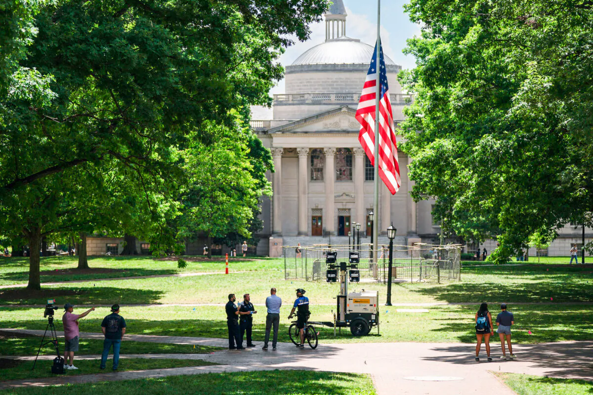 A barricade protects the American flag at Polk Place at the University of North Carolina in Chapel Hill, N.C., on May 1, 2024. (Sean Rayford/Getty Images)