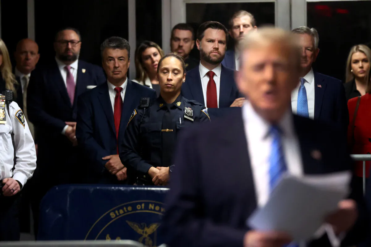 Senator J.D. Vance (R-Ohio) looks on as former President Donald Trump speaks to the media at his trial for allegedly covering up hush money payments at Manhattan Criminal Court in New York City on May 13, 2024. (Spencer Platt/Getty Images)