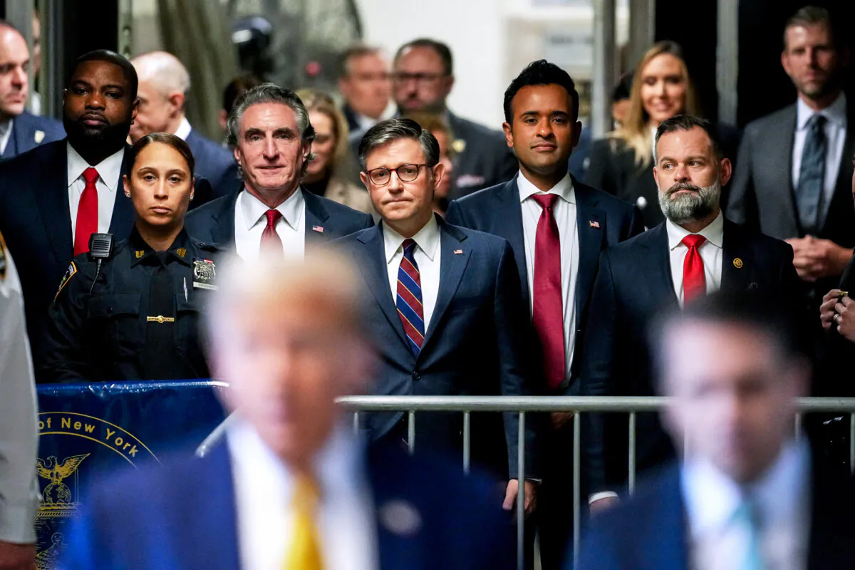(L–R) Rep. Byron Donalds (R-Fla.), North Dakota Gov. Doug Burgum, House Speaker Mike Johnson (R-La.), former presidential candidate Vivek Ramaswamy, and Rep. Cory Mills (R-Fla.) listen as former President Donald Trump speaks to reporters as he arrives to attend his trial at Manhattan Criminal Court in New York City, on May 14, 2024. (Curtis Means/Pool/AFP via Getty Images)