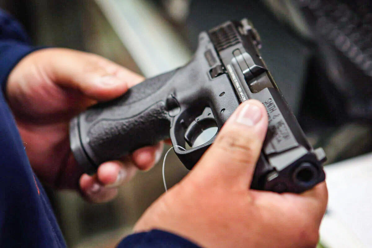 A customer shops for a pistol in Tinley Park, Ill., on Dec. 17, 2012. (Scott Olson/Getty Images)
