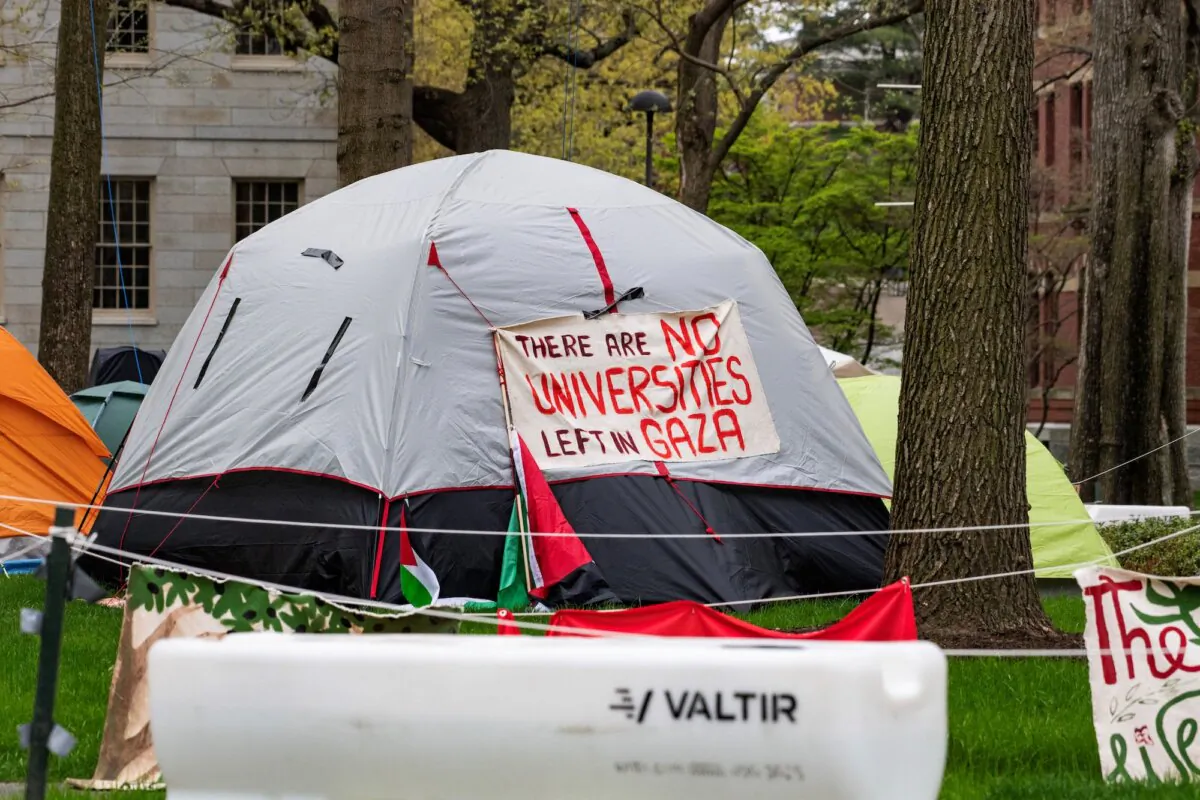 Tents and signs fill Harvard Yard by the John Harvard statue in the Pro-Palestinian encampment at Harvard University in Cambridge, Mass., on May 5, 2024. (Joseph Prezioso/AFP via Getty Images)