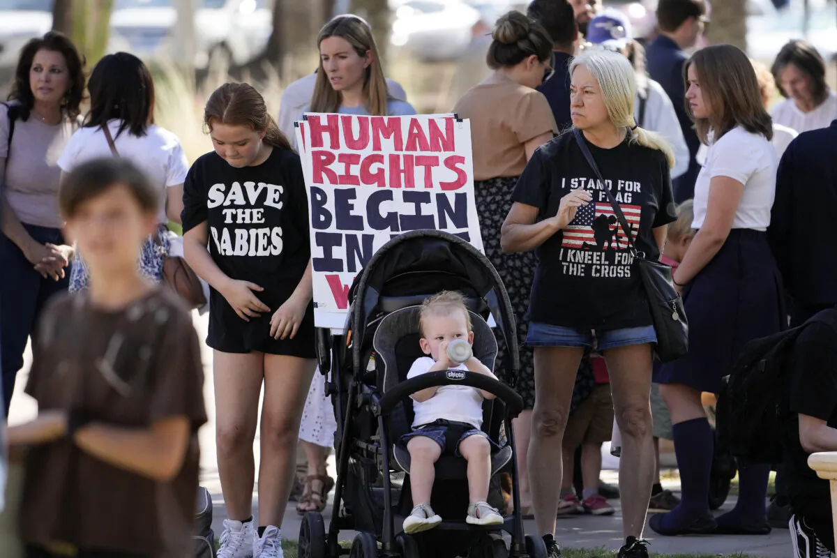 Abortion advocates stand outside the Arizona Capitol in Phoenix on May 1, 2024. (Matt York/AP Photo)