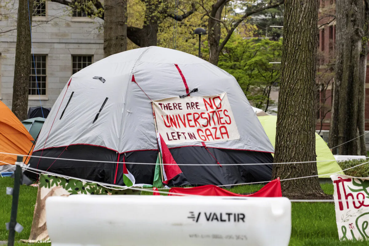 Tents and signs fill Harvard Yard by the John Harvard statue in the Pro-Palestinian encampment at Harvard University in Cambridge, Massachusetts, on May 5, 2024. (Joseph Prezioso/AFP via Getty Images)