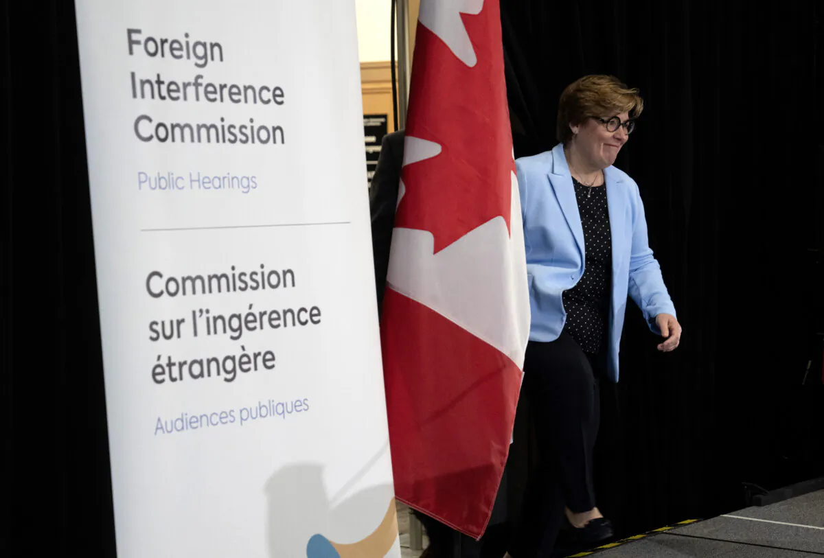 Commissioner Justice Marie-Josee Hogue makes her way on stage to deliver remarks on the interim report following its release at the Public Inquiry Into Foreign Interference in Federal Electoral Processes and Democratic Institutions, in Ottawa on May 3, 2024. (The Canadian Press/Adrian Wyld)