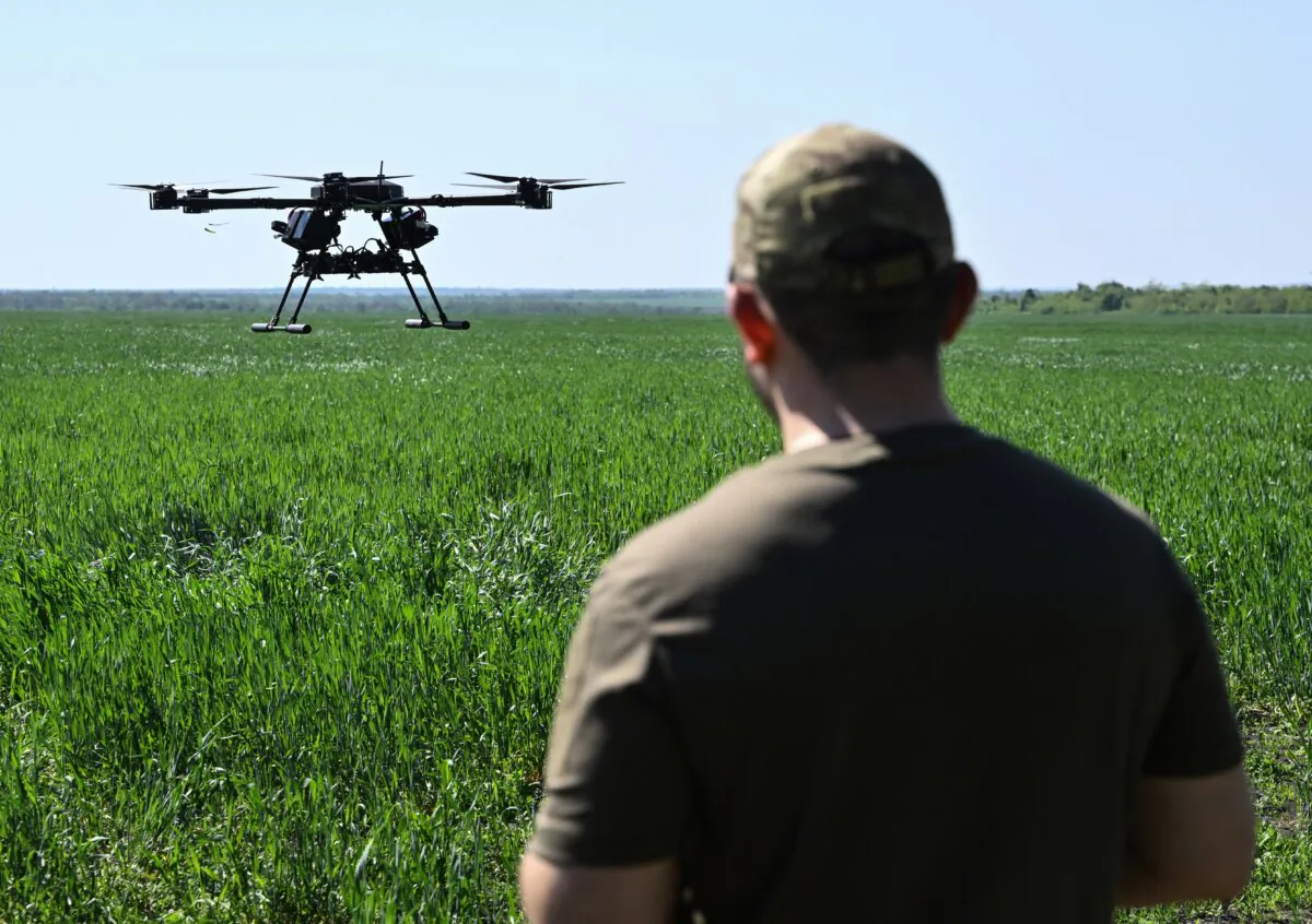 Amid the Russian invasion of Ukraine, a Ukrainian serviceman of the "Achilles" Battalion from the 92nd Brigade of the Ukrainian Army runs tests flights with a Vampire hexacopter drone ahead of missions, in the eastern Donetsk region on April 30, 2024. (Genya Savilov/AFP via Getty Images)