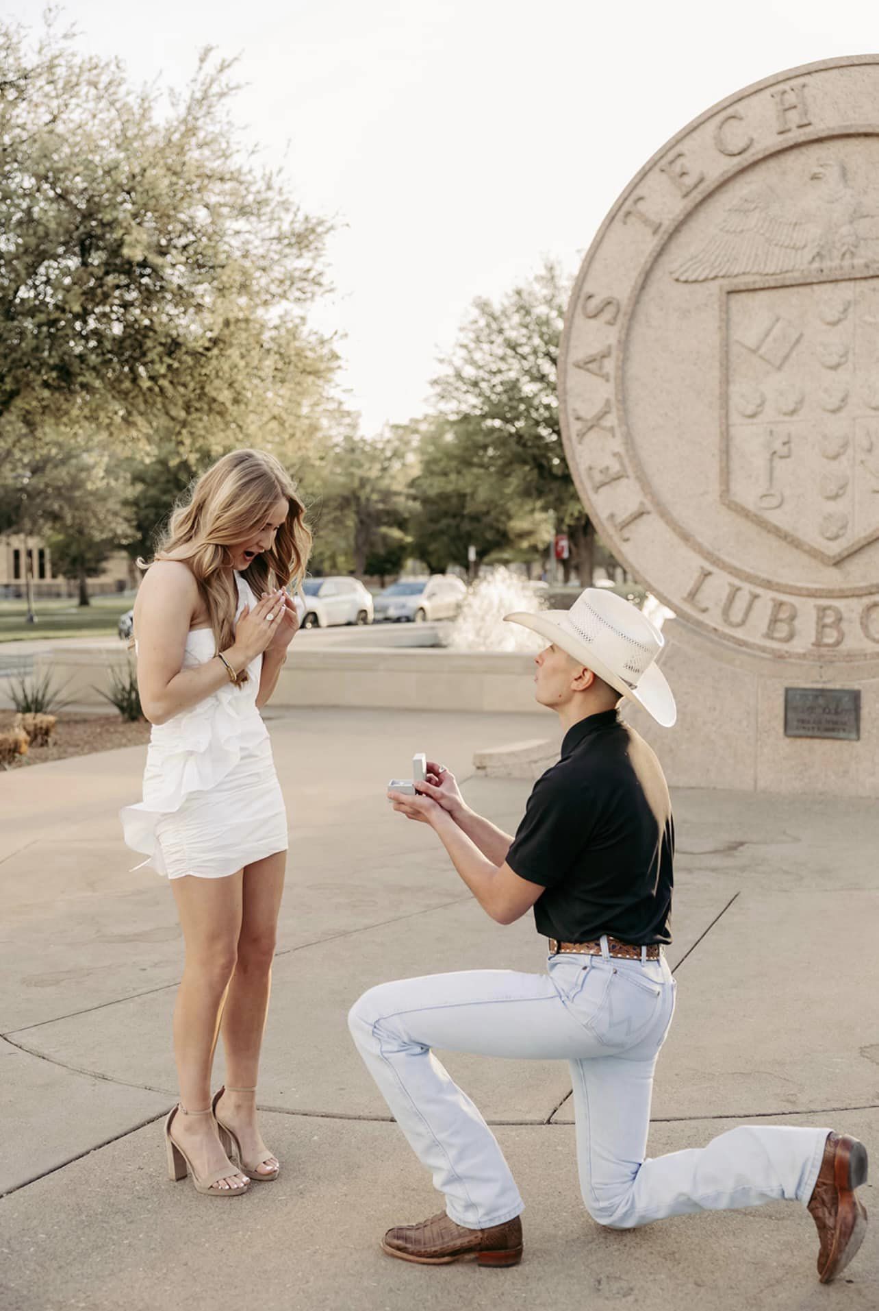 Ms. Hartman goes down on one knee to propose to his girlfriend.